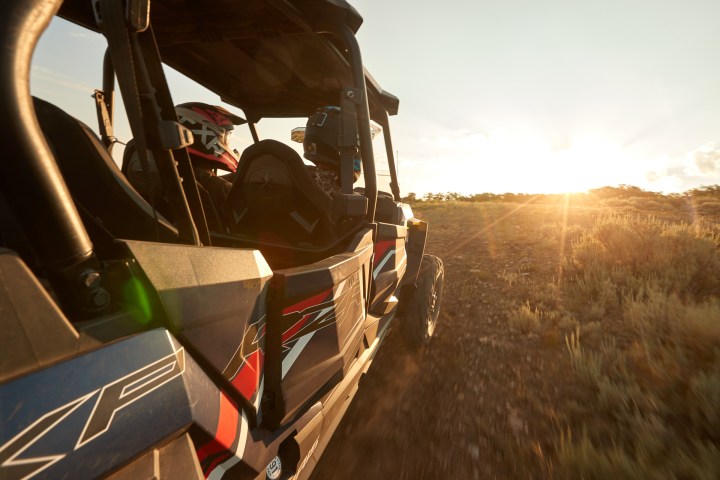 a truck that is sitting on a motorcycle
