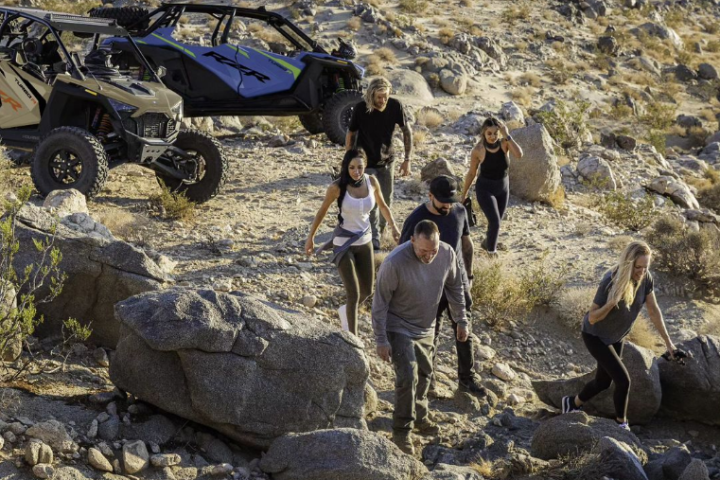 a group of people on a rocky beach