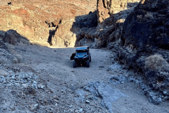 a group of people on a rocky hill