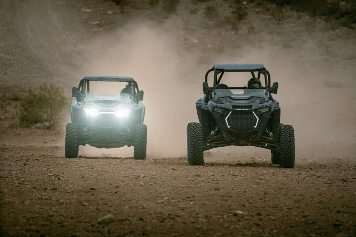 a car driving down a dirt road